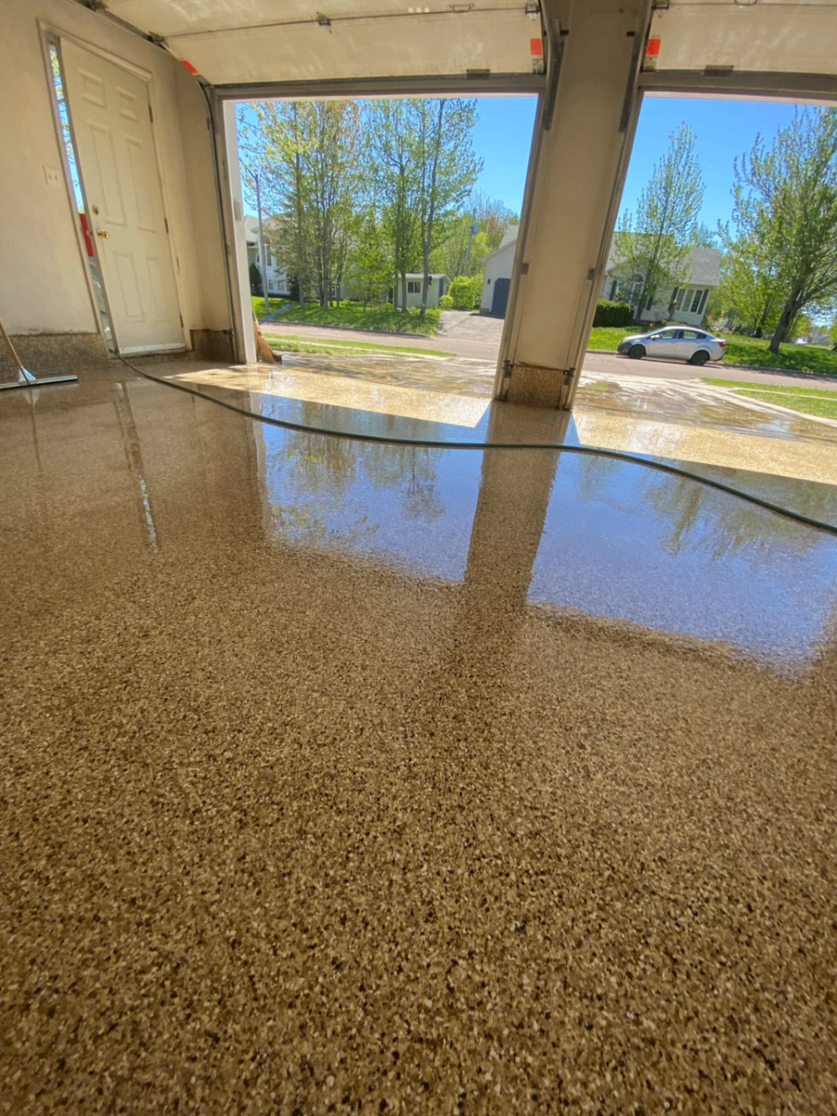 Garage floor after pressure washing looking bright and clean